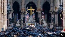 Debris are seen inside Notre Dame cathedral in Paris, April 16, 2019. 