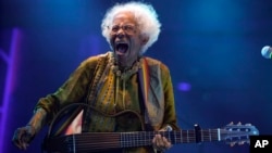 Brazilian singer Catia de Franca, 77, belts out a tune at a warehouse converted into a venue for independent artists in Sao Paulo, Brazil, April 19, 2024. (AP Photo/Andre Penner, File)