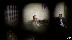 Dutch officer Maj. Gen. Patrick Cammaert, center, who heads a United Nations advance team tasked with monitoring a cease-fire that went into force in the Red Sea port city of Hodeida, is greeted on arrival at Sana'a airport, Yemen, Dec. 22, 2018.