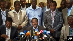 Kalonzo Musyoka, center, Kenya's current Vice President and running mate of presidential candidate Raila Odinga, speaks at a press conference in Nairobi, Kenya, Mar. 7, 2013.