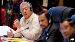 FILE - Philippine Foreign Secretary Perfecto Yasay, left, who was standing in for Philippine President Rodrigo Duterte, attends the ASEAN-U.S. summit at the National Convention Center in Vientiane, Laos, Sept. 8, 2016.