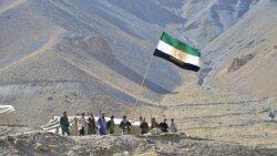 TOPSHOT - Afghan resistance movement and anti-Taliban uprising forces stand guard on a hilltop in the Astana area of Bazarak in Panjshir province on August 27, 2021, as among the pockets of resistance against the Taliban following their takeover of…