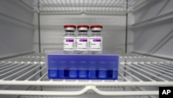 FILE - In this Monday, March 22, 2021 file photo, AstraZeneca and Biontech coronavirus vaccine in a fridge at the vaccine center in Ebersberg near Munich, Germany. AstraZeneca’s release of encouraging data about its coronavirus vaccine from its U.S…