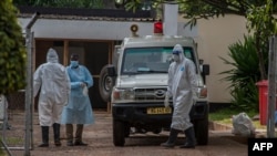 FILE - Medical workers are seen outside the COVID-19 treatment center at Kamuzu Central Hospital in Lilongwe, Malawi, Jan. 18, 2021. Teachers in the country went on strike Feb. 22, 2021, demanding adequate safety equipment and better pay. (L. Masina/VOA)