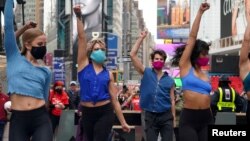 Performers take part in a pop up Broadway performance in anticipation of Broadway reopening in Times Square amid the coronavirus disease (COVID-19) pandemic in the Manhattan borough of New York City, New York, U.S., March 12, 2021
