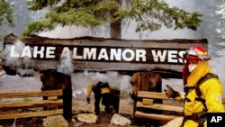 Santa Rosa firefighter Capt. AJ Alcocer and his crew battle the Dixie Fire in the Lake Almanor West community on Aug. 5, 2021, in Plumas County, Calif.