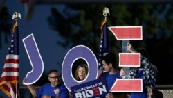 Supporters hold a sign before a campaign rally for Democratic presidential candidate former Vice President Joe Biden, March 3, 2020, in Los Angeles.