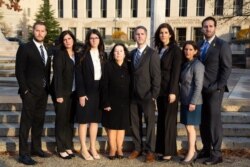 The seven children and wife of Robert Levinson, an American missing in Iran since 2007, appear outside U.S. District Court in Washington, Dec. 4, 2019, as they sue Iran for damages for his disappearance. (Courtesy Levinson family)