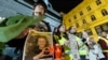 People hold portraits of the late Russian opposition leader Alexey Navalny, who died in a Russian Arctic prison, as they gather to pay tribute during a candle vigil in downtown Zagreb, Croatia, Feb. 23, 2024. Navalny's body reportedly was handed over to his mother on Feb. 24.