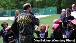 A girl scout is reacting during a martial arts session at a Girl Scout camp in Catoctin Park, Maryland. (Photo by Diaa Bekheet)