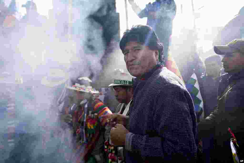 Former President Evo Morales participates in an offering to Mother Earth before leading a march to Bolivia's capital, as part of a political dispute with current President Luis Arce and to protest his handling of the economy, in Caracollo, Oruro, Bolivia.