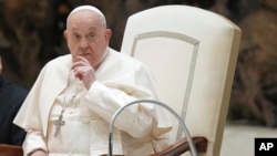 Pope Francis attends his weekly general audience in the Paul VI Hall, at the Vatican, Jan. 8, 2025. On Thursday, he condemned Israel's military campaign in Gaza, calling the humanitarian crisis "very serious and shameful."  