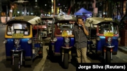 A tuk tuk driver waits for customers at Khaosan Road as tourism has decreased after coronavirus outbreak in Bangkok, Thailand March 12, 2020. REUTERS/Jorge Silva