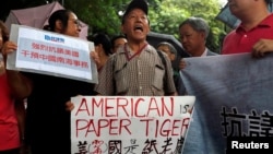 A protester from a local pro-China party chants slogans against the United States supporting an international court ruling that denied China's claims to the South China Sea, outside U.S. Consulate in Hong Kong, China July 14, 2016. 