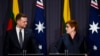 Australian Foreign Affairs Minister Marise Payne, right, and Lithuania's counterpart Gabrielius Landsbergis hold a press conference at Parliament House in Canberra, Australia, Wednesday, Feb. 9, 2022.