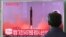 FILE - A man watches a TV screen showing a file footage of North Korea's missile launch, at the Seoul Railway Station in Seoul, South Korea, Aug. 29, 2017. 