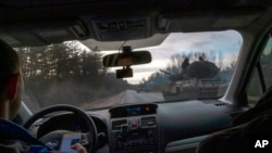 A Ukranian army vehicle moves along a road on the outskirts of Severodonetsk, the Donetsk region, eastern Ukraine, Feb. 24, 2022. Russia launched a wide-ranging attack on Ukraine on Thursday.