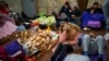 People rest in the Kyiv subway, using it as a bomb shelter in Kyiv, Ukraine, Feb. 24, 2022. 