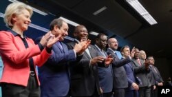 European Union and African Union leaders gather for a media conference during an EU Africa summit in Brussels, on Friday, Feb. 18, 2022. (Olivier Hoslet, Pool Photo via AP)