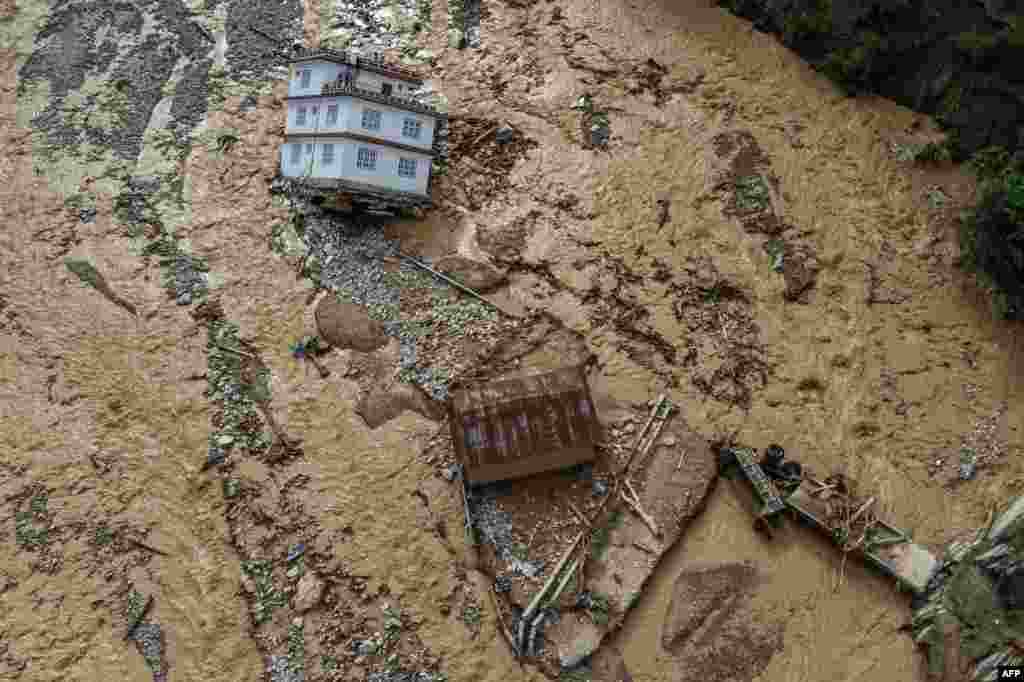 An aerial view shows the area affected by monsoon flooding in Roshi village of Nepal's Kavre district.&nbsp;Search and rescue teams in the country's capital picked through wrecked homes after waters receded from monsoon floods that killed at least 209 people around the Himalayan republic.