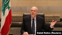 Lebanon's caretaker Prime Minister Najib Mikati gestures as he heads a cabinet meeting at the government palace after a ceasefire between Israel and Hezbollah took effect, in Beirut, Nov. 27, 2024.