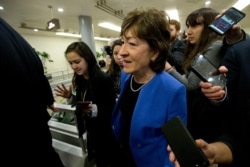 Senators Susan Collins of Maine talks to reporters before attending the impeachment trial of President Donald Trump on charges of abuse of power and obstruction of Congress, Jan. 28, 2020, on Capitol Hill in Washington.
