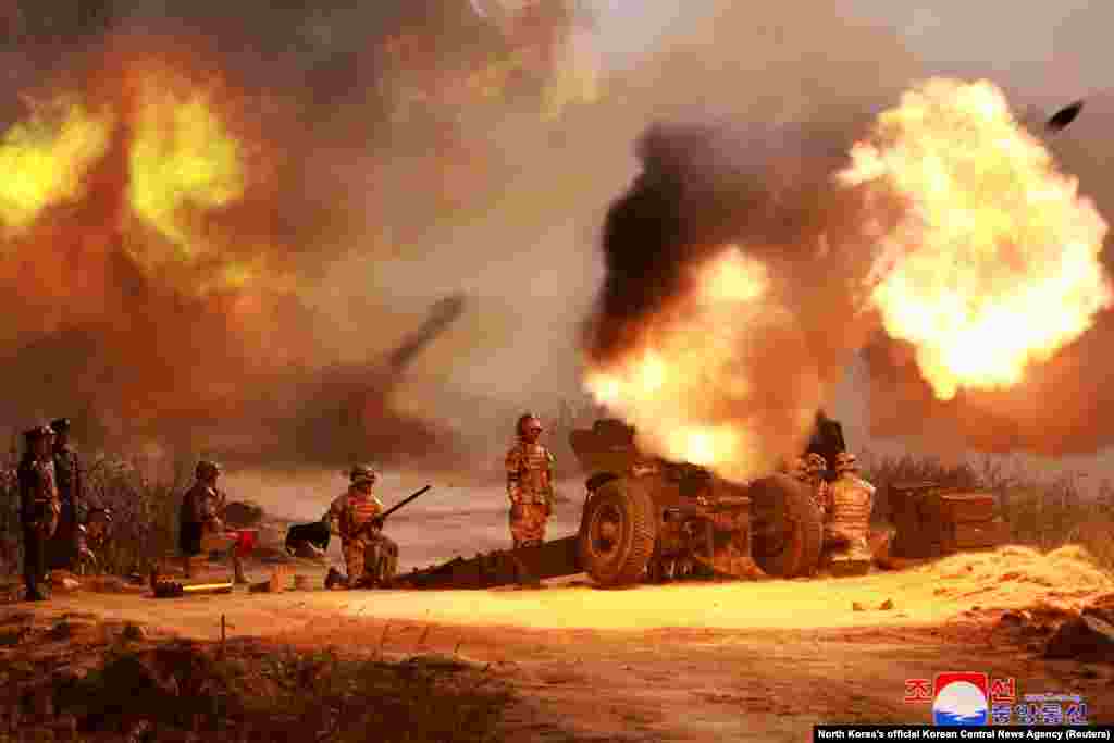 A view shows the live ammunition shooting training of the graduates of the 75th class of O Jin U Artillery Academy, in progress, at an undisclosed location, in North Korea&nbsp;in this handout picture released by North Korea's official Korean Central News Agency.