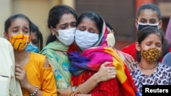 Porodica preminulog od Kovida 19 u Indiji