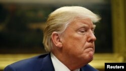 U.S. President Donald Trump answers questions from the news media during an event at which he announced a grant for a drug-free communities support program in the Roosevelt Room of the White House in Washington, Aug. 29, 2018.