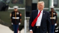 President Donald Trump walks from Marine One to board Air Force One for a trip to Miami to deliver a speech on Cuba policy, June 16, 2017, at Andrews Air Force Base, Md.