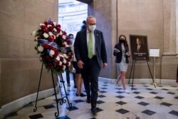 Senate Minority Leader Senator Chuck Schumer walks to the office of House Speaker Nancy Pelosi of Calif., on Capitol Hill in Washington, July 29, 2020.