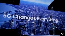 Drew Blackard, product marketing manager, talks about the new Samsung Galaxy S10 5G smartphone during an event, Feb. 20, 2019, in San Francisco.