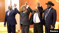 From right, Sudan's President Omar Al-Bashir hold hands with Uganda's President Yoweri Museveni, South Sudan's President Salva Kiir and South Sudan rebel leader Riek Machar during a South Sudan peace meeting in Khartoum, Sudan, June 25, 2018. 