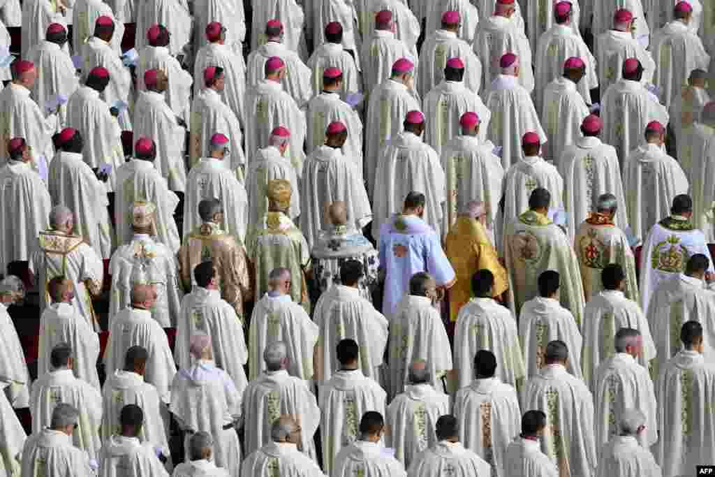 Prelates attend a Holy Mass for the opening of the Ordinary General Assembly of the Synod of Bishops at St. Peter's square in The Vatican.