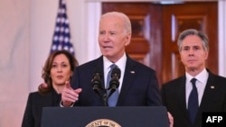 US President Joe Biden, alongside Vice President Kamala Harris (L) and Secretary of State Antony Blinken (R), speaks about the Israel-Hamas ceasefire and hostage release deal in the Grand Foyer of the White House on January 15, 2025.