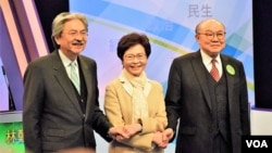 Hong Kong Chief Executive candidates, from left, John Tsang, Carrie Lam and Woo Kwok Hing attend TV Debate.