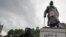 FILE - Protesters gather around the Winston Churchill statue in Parliament Square during a Black Lives Matter rally in London June 7, 2020.
