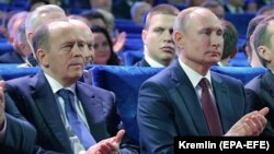 RUSSIA -- Russian President Vladimir Putin (R) and Federal Security Service Director Aleksandr Bortnikov attend a concert marking Russian Security Service Officer Day, in Moscow, December 19, 2019