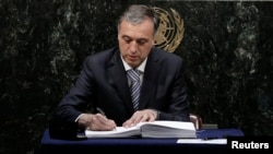 Montenegro President Filip Vujanovic signs the Paris Agreement on climate change at the United Nations Headquarters in New York, April 22, 2016.