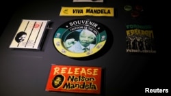 Memorabilia with the face of former South African President Nelson Mandela, are displayed at the Apartheid Museum, one of several attractions and art galleries around the country forced to close their doors due to the pandemic. (REUTERS/Siphiwe Sibeko)