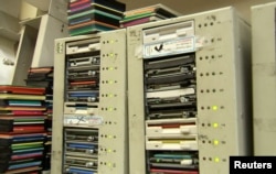 Tom Persky, the owner of floppydisk.com, uses older computers to format the disks that he sources from second-hand websites and eBay at his warehouse in Lake Forest, California, U.S., October 6, 2022 in this screengrab from a Reuters TV video. (REUTERS/Alan Devall)