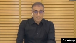 FILE - An undated social media photo of Reza Valizadeh, a former Radio Farda journalist and Iranian American dual citizen arrested in Iran in September 2024. 