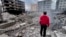 A man looks at buildings destroyed by Israeli airstrikes in Dahiyeh, Beirut, Lebanon, on Oct. 7, 2024.