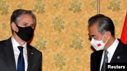 FILE - U.S. Secretary of State Antony Blinken meets Chinese Foreign Minister Wang Yi on the sidelines of the G-20 summit in Rome, Oct. 31, 2021. (Tiziana Fabi/Pool via Reuters)