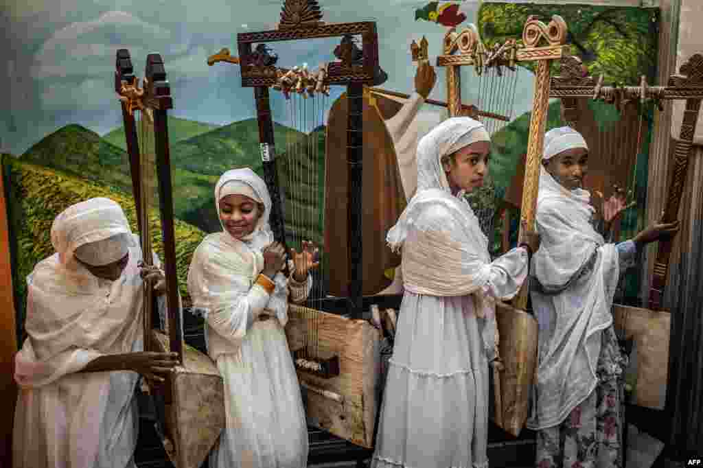 Young beginner students hold their begenas after a class practice session at Eman Begena School in Addis Ababa, Ethiopia.