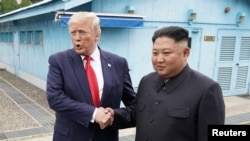 U.S. President Donald Trump meets with North Korean leader Kim Jong Un at the DMZ