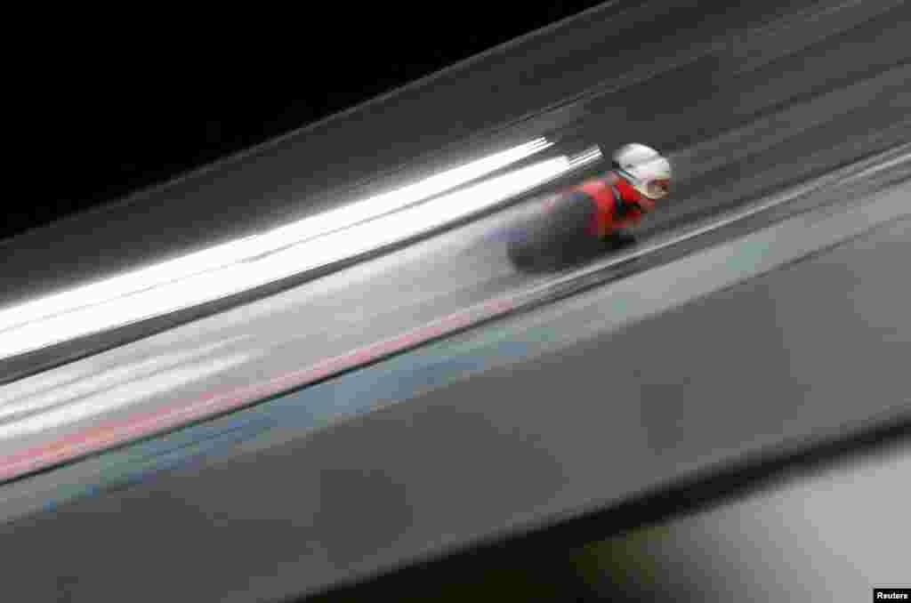 Kamil Stoch of Poland competes in men's ski jumping during the 2022 Beijing Olympics at the National Ski Jumping Centre, Zhangjiakou, China.