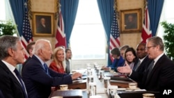 British Prime Minister Keir Starmer, right, and Foreign Secretary David Lammy, second right, meet with U.S. President Joe Biden, center left, at the White House in Washington, Sept. 13, 2024. 