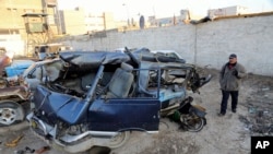 Portlatilgan mashinalardan biri. Bag'dod. 16-dekabr 2013. 