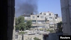 Passengers whose travel plans were affected by Typhoon Usagi wait at airline counters at Hong Kong's international airport, Sept. 23, 2013.